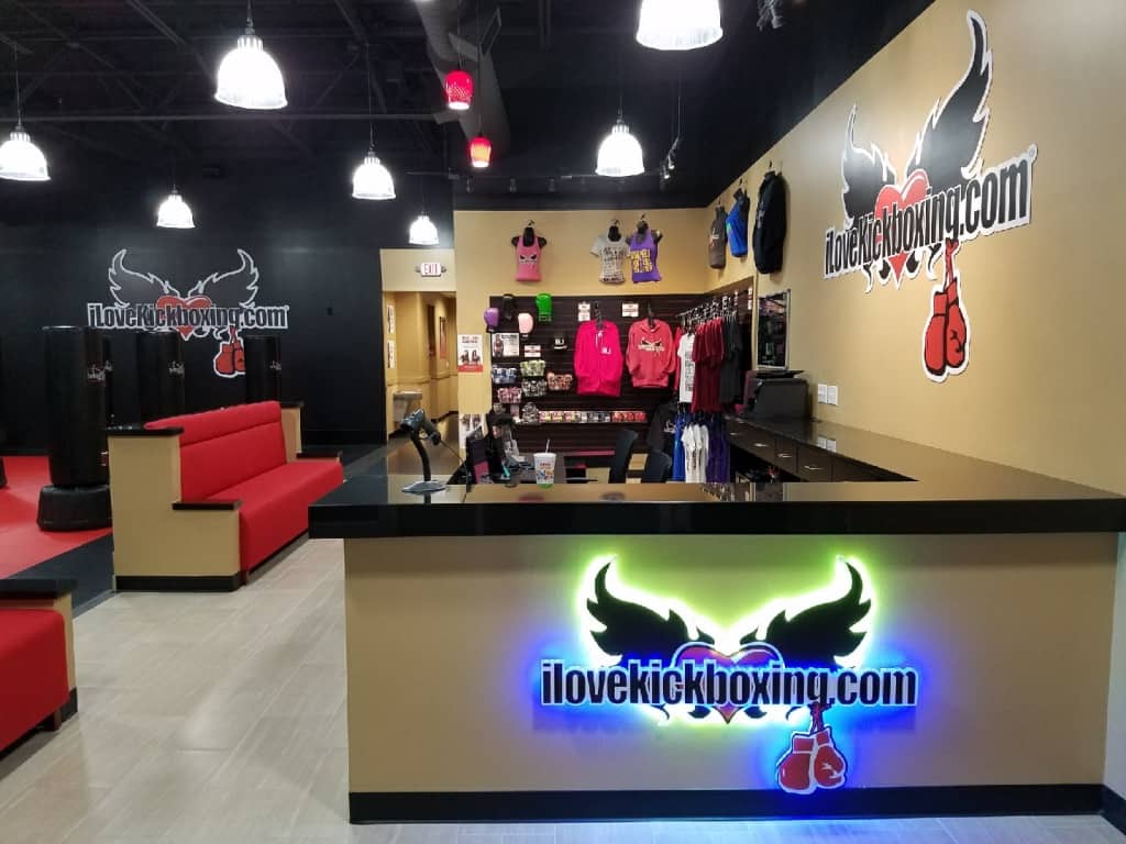 CapitalTexas-construction-interior-tenant-finish-out-improvement-ADA-compliant-ilovekickboxing-desk-front-reception-signage-illuminated